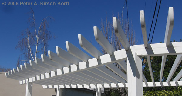 Detail of matching decorative wood arbor rafter cuts