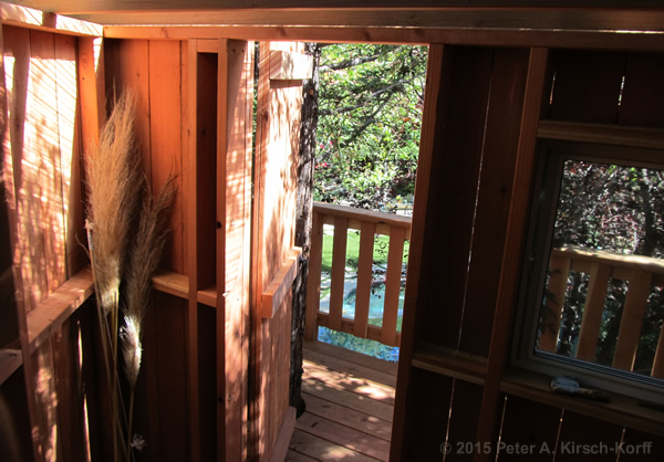 Interior view of traditional clubhouse with windows and door of Redwood Treehouse - Pasadena, CA